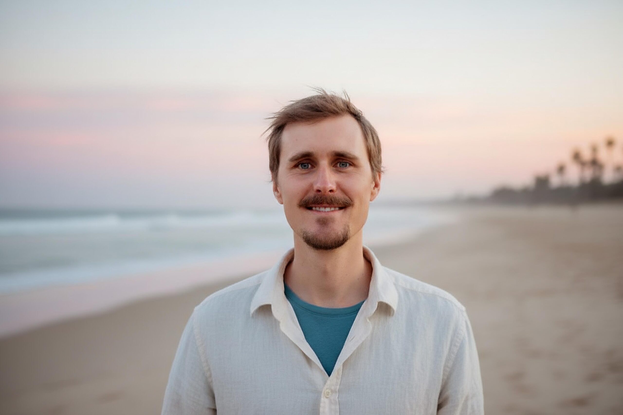 Kevin Shroads at the shoreline at sunset